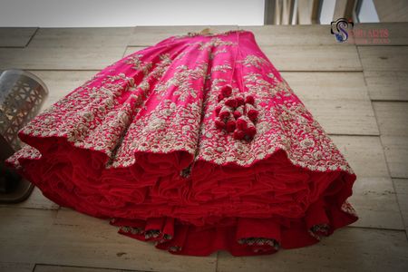 Bright pink lehenga with can can on hanger 