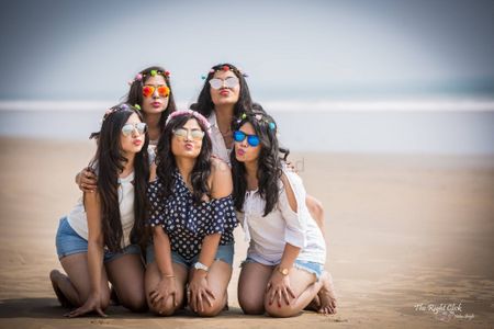 Photo of Bride with bridesmaids on beach