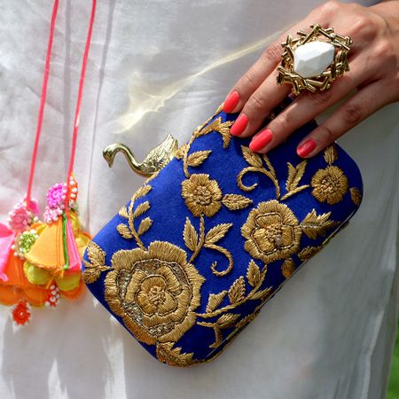 Photo of blue and gold clutch
