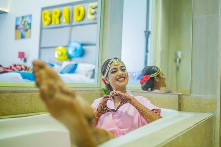 Photo of Bride in bathtub getting ready photo idea