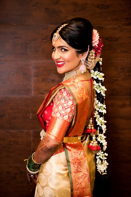 South Indian bridal braid with flowers 