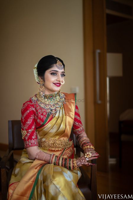 Red and gold bridal kanjivaram and nath 