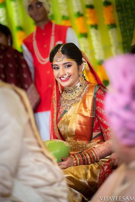 Bride in red and gold kanjivaram saree 
