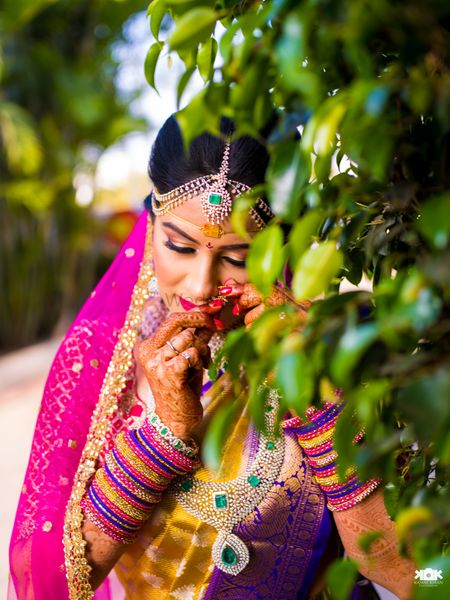 South indian bridal portrait adjusting nosering 