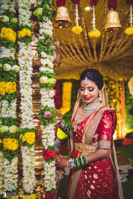 south indian bridal look in a red kanjivaram and waistbelt 