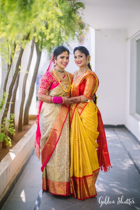 Bride and bridesmaid in pretty sarees