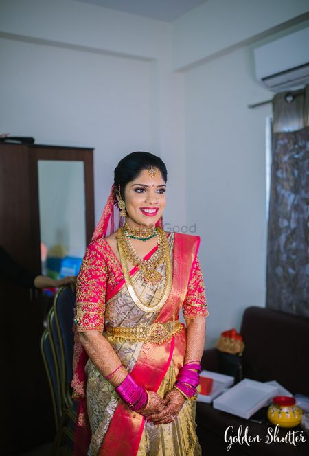 South Indian bride in a Pink & White Kanjeevaram