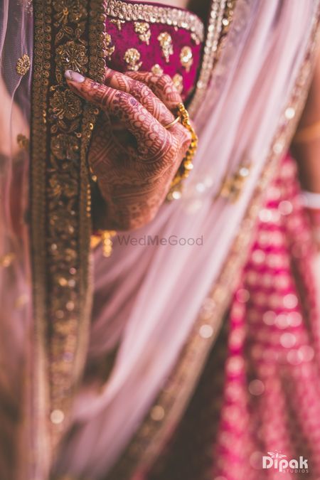 Close up bridal hands and dupatta shot 