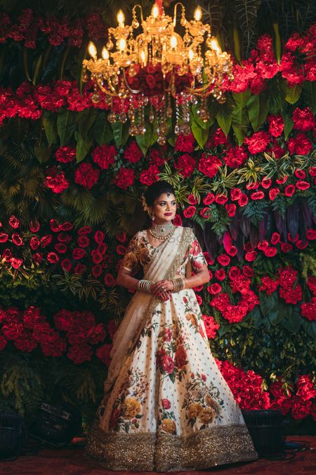 Floral lehenga and floral wall backdrop 