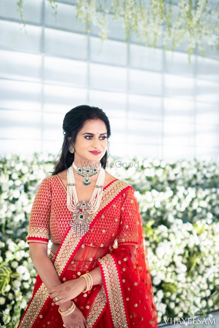 Bride dressed in a monotone red lehenga with contrasting jewellery. | Red  lehenga, Bridal lehenga collection, Delhi wedding