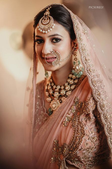 A bride with unique polki and jadau jewellery