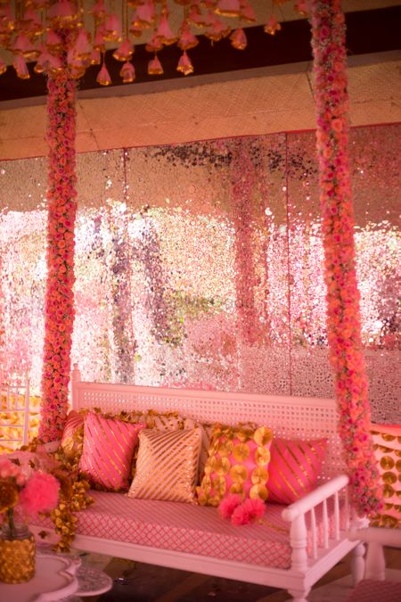 Photo of Bright pink decor for mehendi swing set