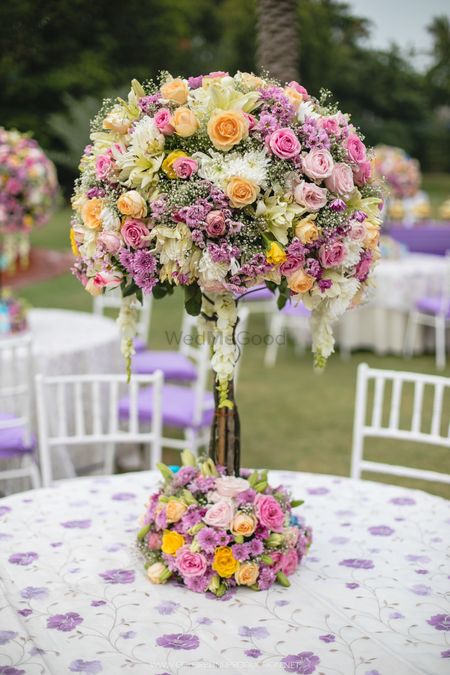 Photo of Stunning colourful table pieces with flowers
