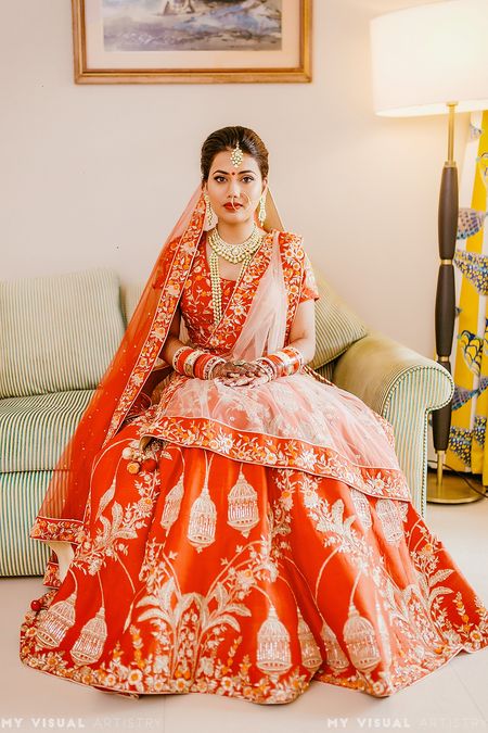 Lehenga with birdcage motif in red and gold 