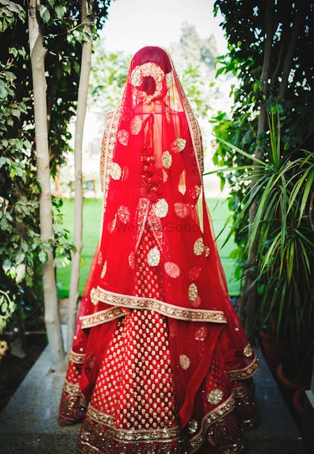 Photo of Bridal back red lehenga shot