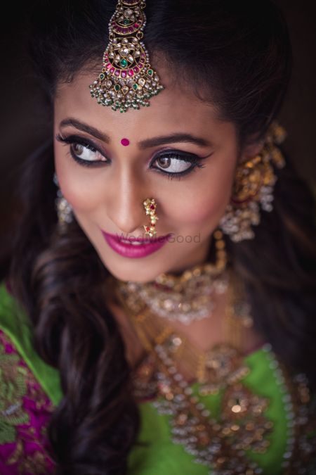 Dramatic mehendi makeup with winged liner 