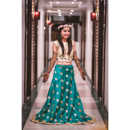 Bride in turquoise blue mehendi outfit