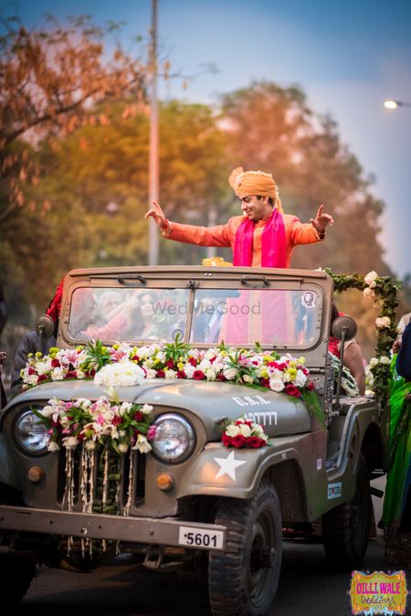 Groom entering in a jeep 