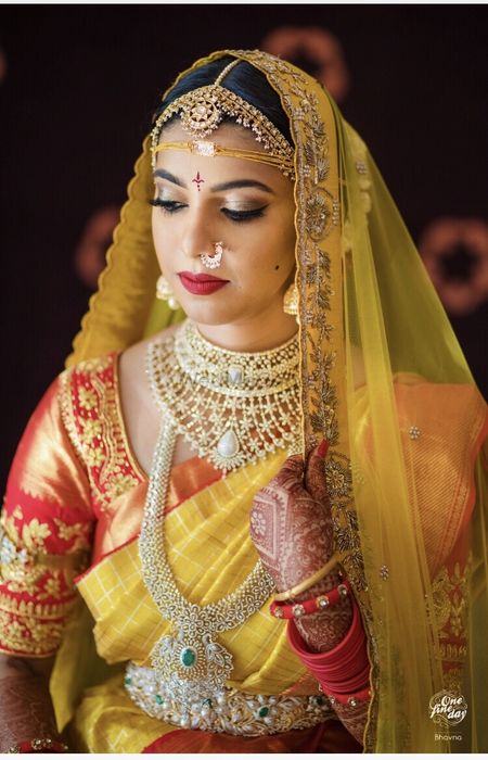 Photo of South Indian layered bridal jewellery with diamonds and emeralds