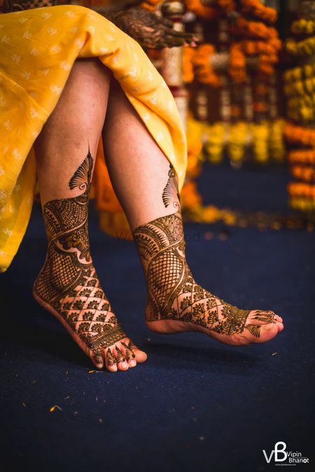 A bride with mehendi on her feet