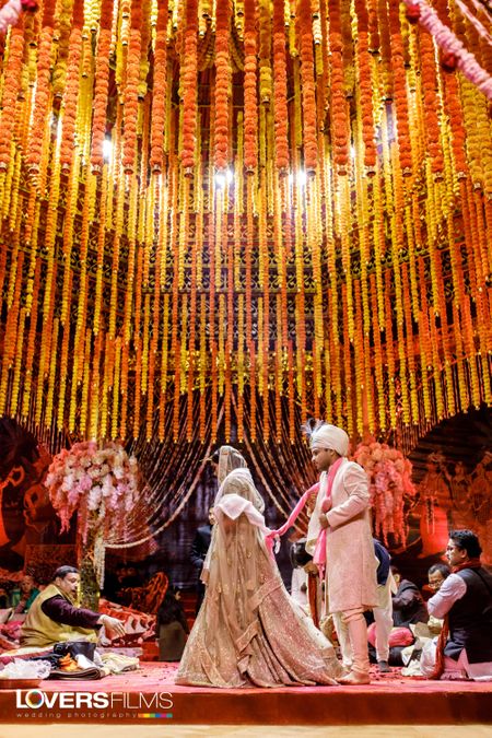 Mandap decor with floral strings hanging 
