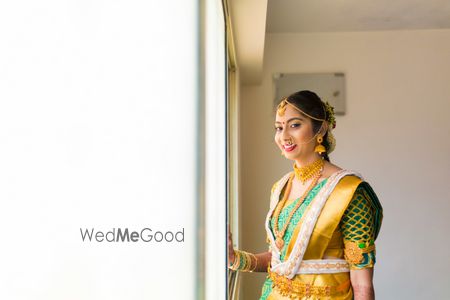 South Indian bride with gold and green saree 