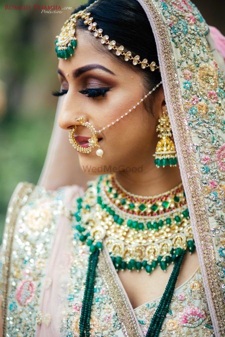 Layered bridal jewellery with green beads 