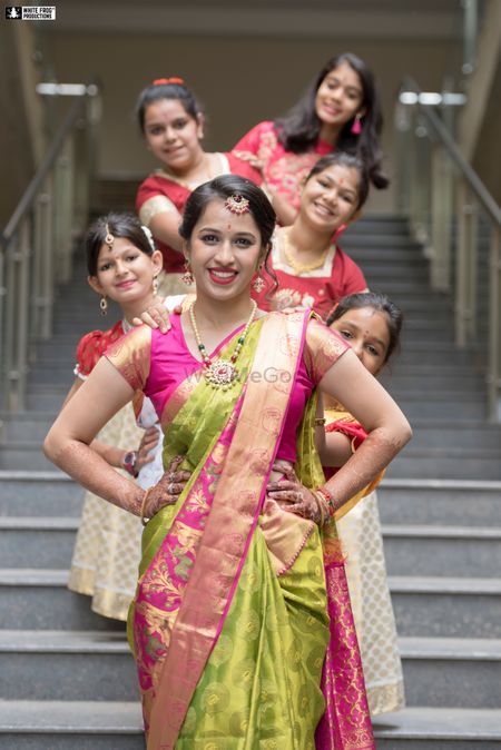 Photo of A south Indian bride poses with her kid bridesmaids
