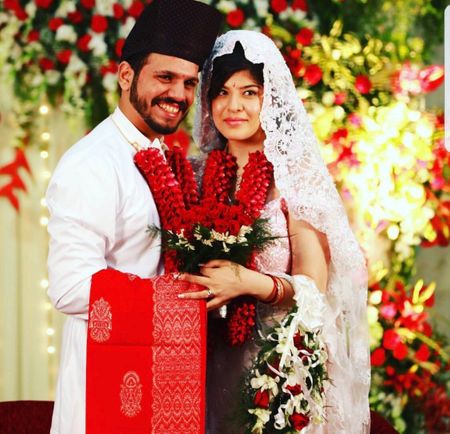 A parsi bride and groom in white and red