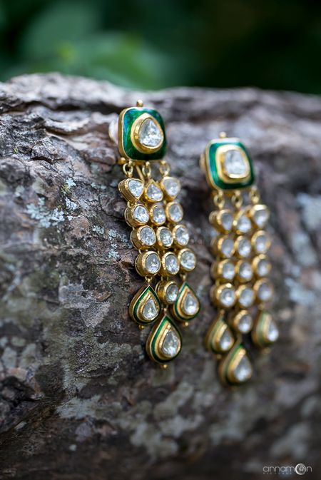 Bridal polki earrings on log 