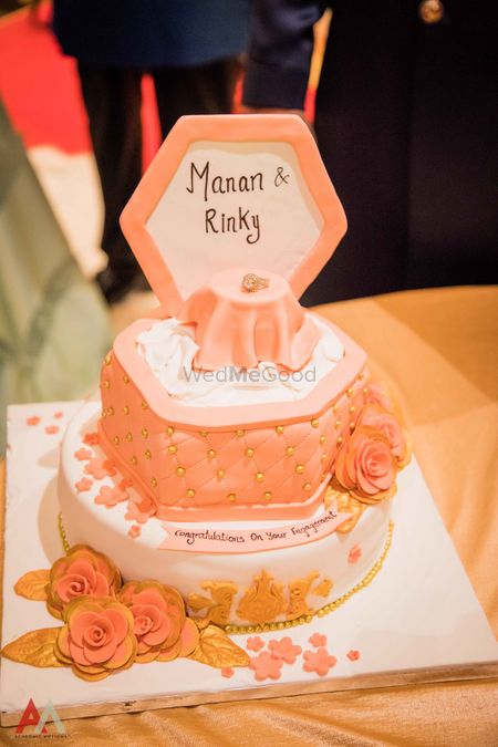 Pretty peach and white floral cake for engagement. 