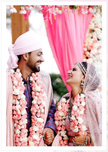 Happy couple shot with unique jaimala 