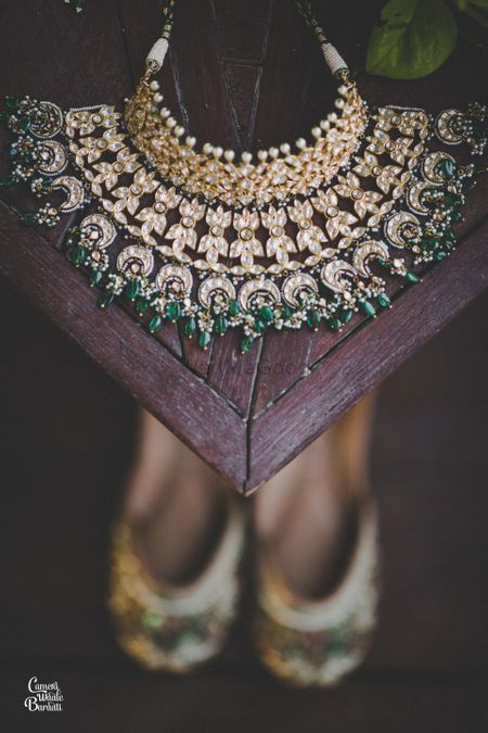 Dark green jewellery photography with shoes 