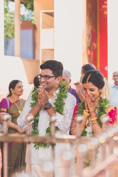 A south Indian couple praying on their wedding day