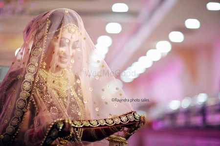 Photo of A sikh bride takes her dupatta as a veil