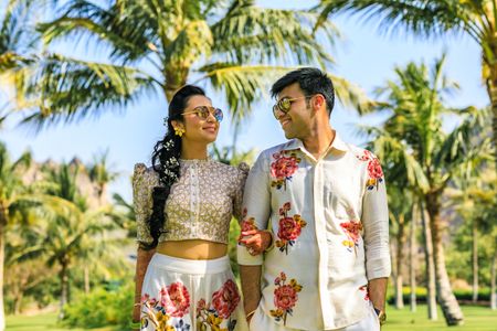 Photo of Mehendi bride and groom look twinning in florals
