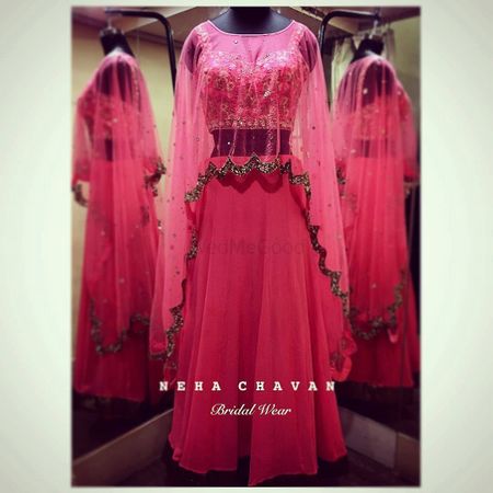 Photo of Light pink lehenga with long net cape with gold border