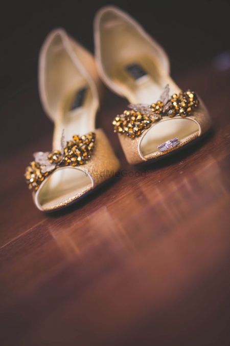 gold shoes with bows