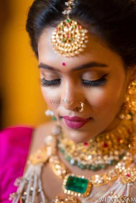 South indian bride with pink and brown makeup 