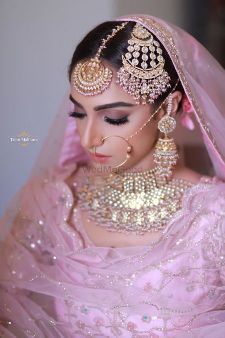 Sikh bride with pastel jewellery and jhoomer 