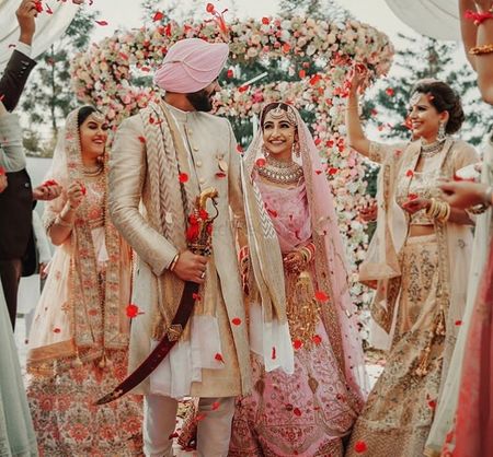 Pastel bride and groom during sikh wedding 