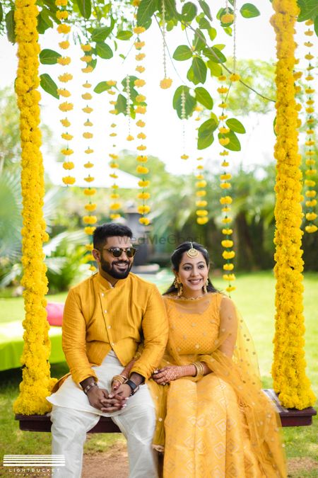 Haldi seating with matching bride and groom 