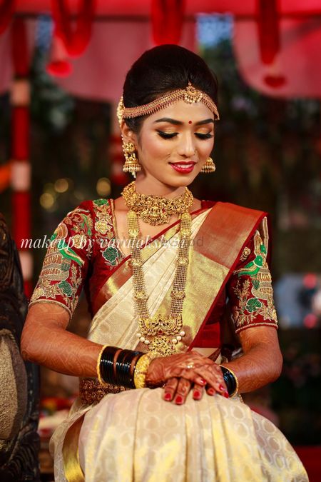 South Indian bride in plain saree and unique blouse 