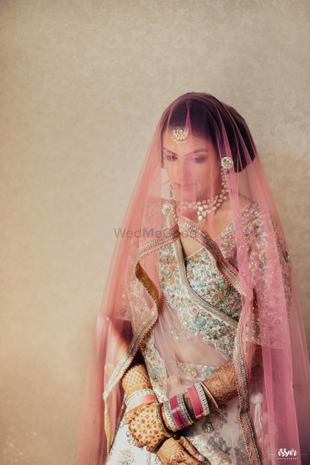 Bridal portrait with dupatta as a veil 