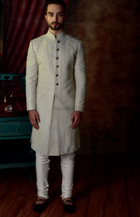 Photo of Classic ivory sherwani for grooms.