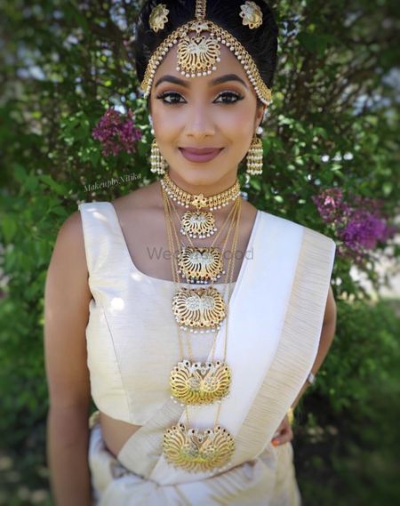 Photo of Bride wearing unique necklace