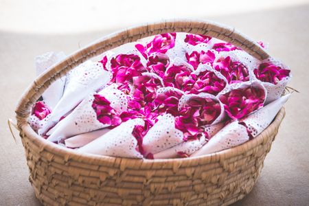 Photo of Flower petals for guests to throw in basket and cones
