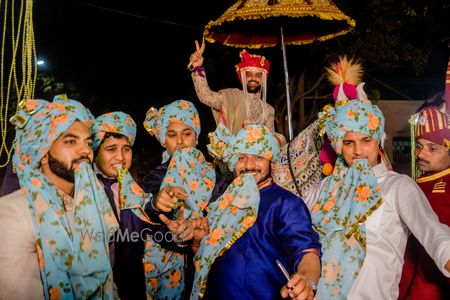 Matching groomsmen with floral safa in baraat