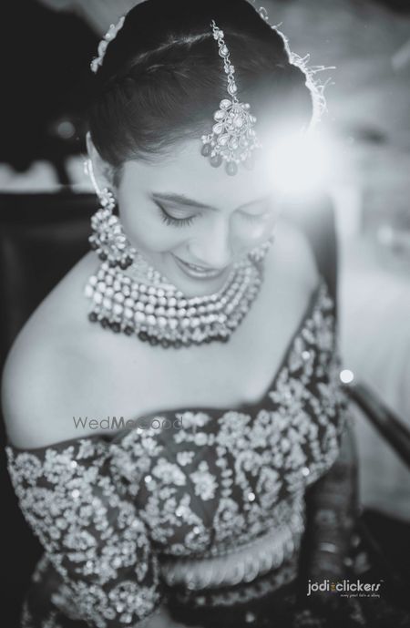 Photo of Black and white bridal portrait with off shoulder blouse