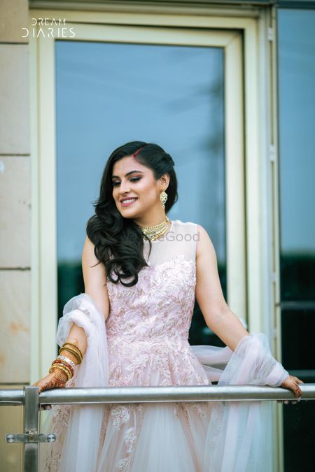 Bride in pastel pink engagement gown 